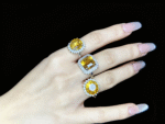 Gold Rutilated Quartz ring in a high-end business or celebration setting, with strategic plans or celebratory champagne.