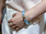 Bracelet worn in versatile settings, like working in a café or during team meetings, showcasing its all-round companionship.
