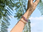 Model wearing Amethyst bracelet on wrist, showcasing mystical elegance and a serene aura.