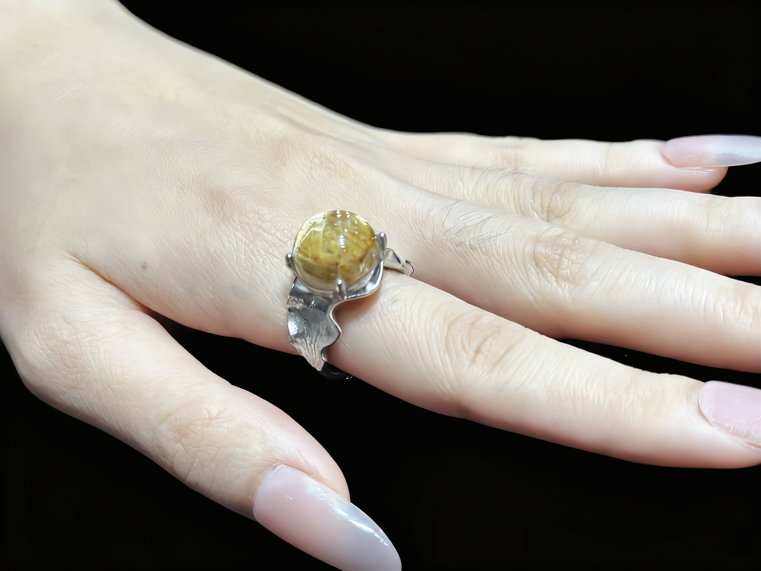 Gold Rutilated Quartz Energy Ring - Wealth and Decisiveness Concentrated at Your Fingertip Model wearing the Gold Rutilated Quartz ring on finger, showcasing a powerful aura and exceptional confidence.