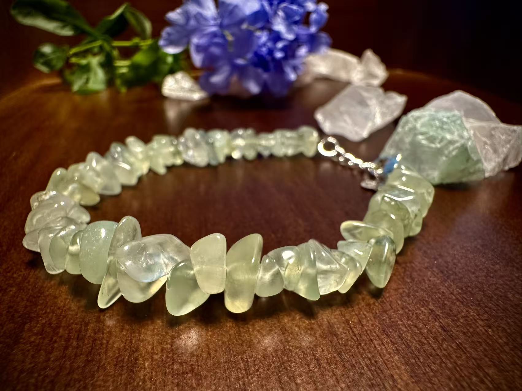Green Quartz Clarity Detail - Reflecting the Light of Wood Growth & Balance Close-up of Green Quartz bead, revealing internal clarity and soft luster, a window to heart chakra energy.