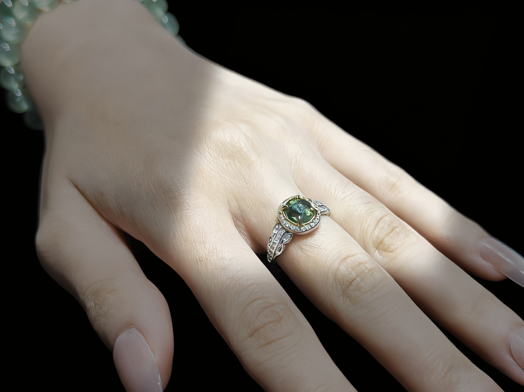 Natural Green Tourmaline ring overall view, rich green stone symbolizing growth energy and wealth attraction.