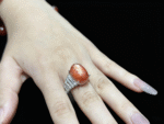 Natural Rose Quartz ring overall view, soft pink stone set in an elegant band.