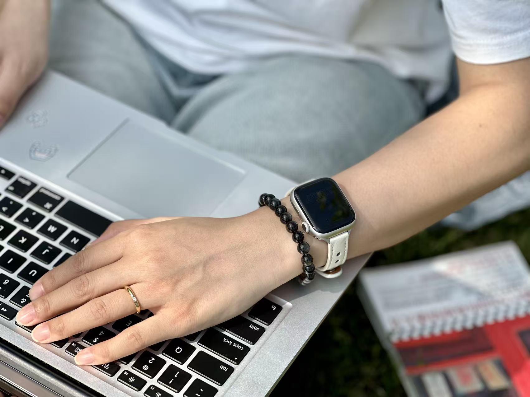 Water Element Cleansing Ritual - Activating Deep Intuition of Cat's Eye Black Cat's Eye bracelet placed on deep blue fabric with seashells for Water element cleansing.